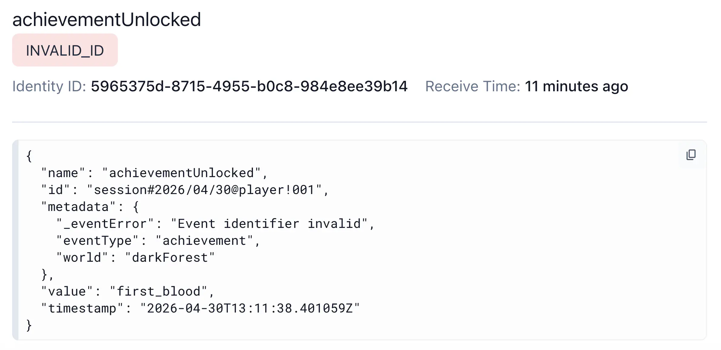 The achievementUnlocked event rejected with INVALID_ID, showing an id with special characters and _eventError: Event identifier invalid